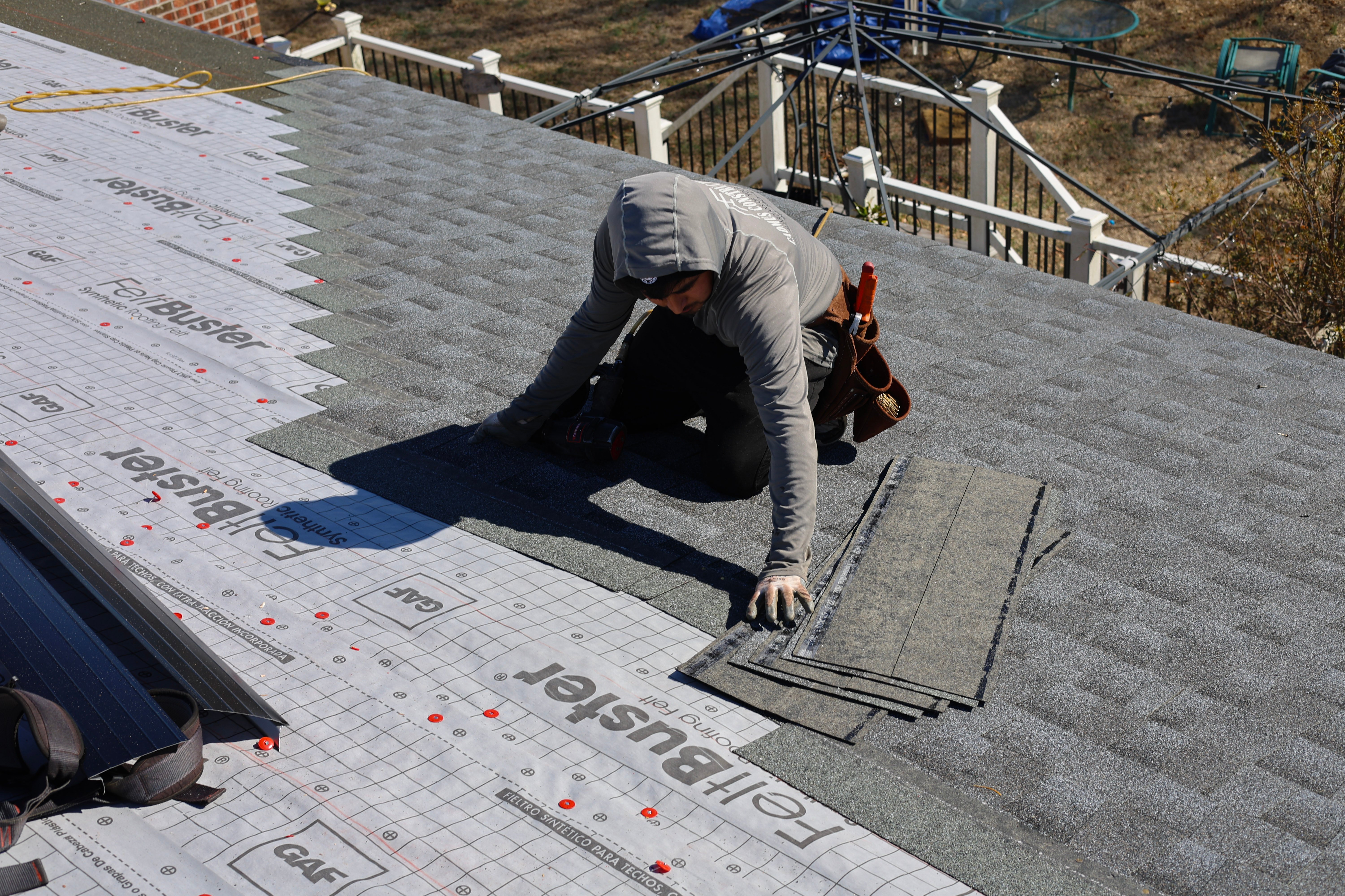 Residential-roof-repair-being-completed-by-a-roofing-contractor-on-an-asphalt-shingle-roof-in-Raleigh-North-Carolina