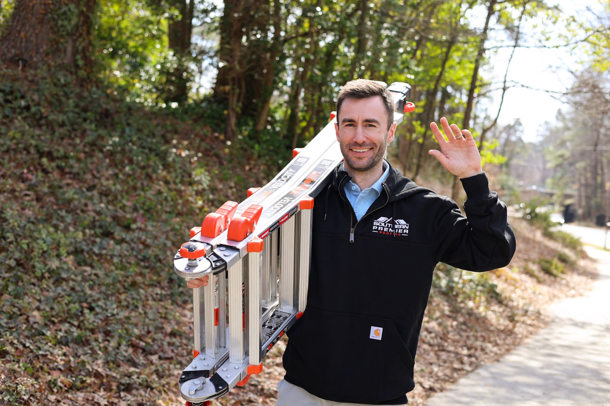 best rated roofing company roofer carrying ladder